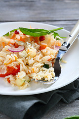 Delicious rice with vegetables and basil