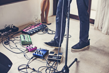 musical equipment and a couple's foot