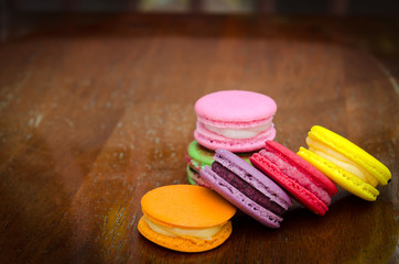 French macarons on wood background