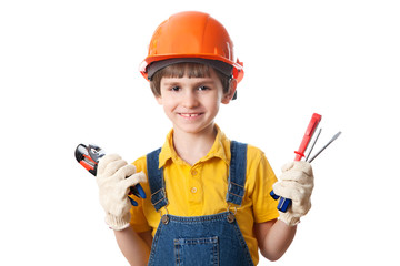 Smile boy holds building tools, isolated on white