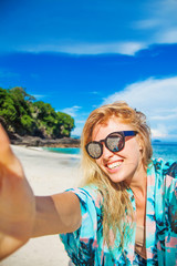 woman doing selfie on a beach