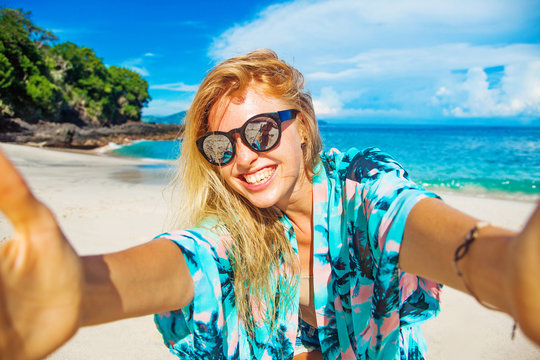 Woman Doing Selfie On A Beach