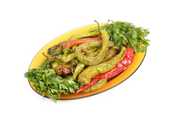 fried peppers salad in a dish on white background