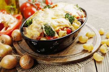 Casserole with meat, pasta, broccoli and tomatoes