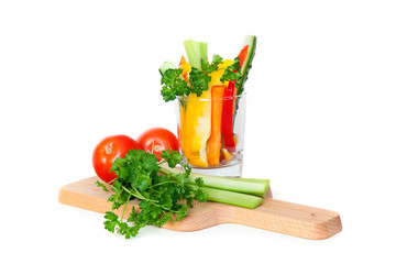 Fresh vegetables on cutting board, isolated on white background