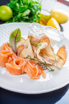 Sliced salted salmon served with bread