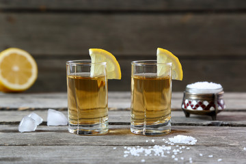 Glasses of tequila with lemon and salt