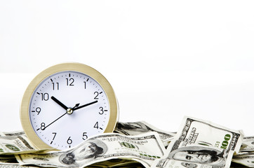 Close-up of clock and money with white background