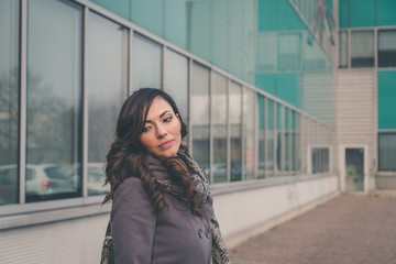 Beautiful girl posing in an urban context