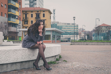 Beautiful girl posing in an urban context