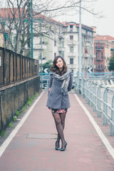 Beautiful girl posing in an urban context