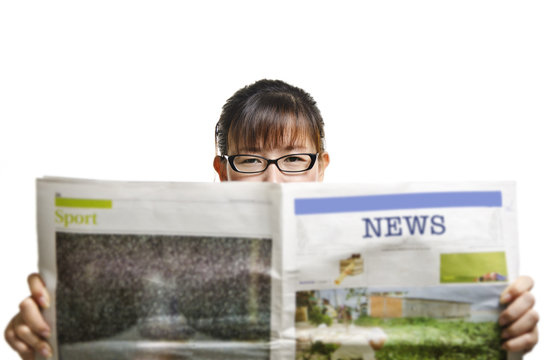 a woman reading newspaper against white background