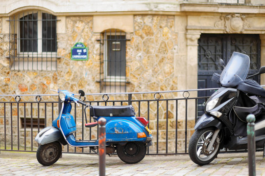 Retro scooter parked on Paris street