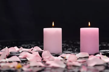 Fotobehang pink rose petals with pink candle and therapy stones © Mee Ting