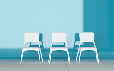Three modern chairs in a blue room