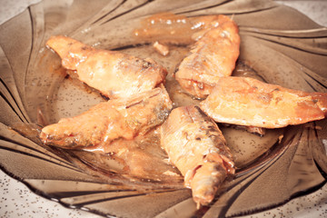 Carp on a plate for preparing sushi