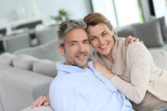 Portrait of mature couple relaxing at home