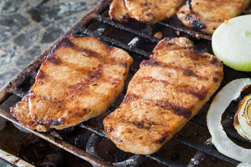 Pork steaks on grill
