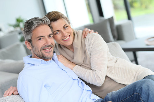 Portrait of mature couple relaxing at home