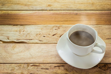 Hot coffee on wood table