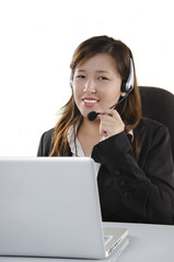 Confident female customer service agent with headset