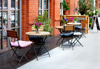 Fototapeta na wymiar tables and chairs - the restaurant