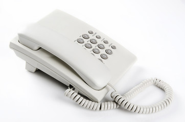 Office telephone against white background