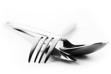 Fork, spoon and knife on white