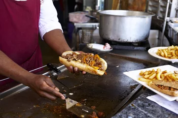 Fototapeten Cooking a sandwich at a restaurant in the street in Nairobi © fresnel6