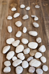 Pebble on the distress wooden background