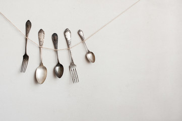 Cutlery hangs on the string