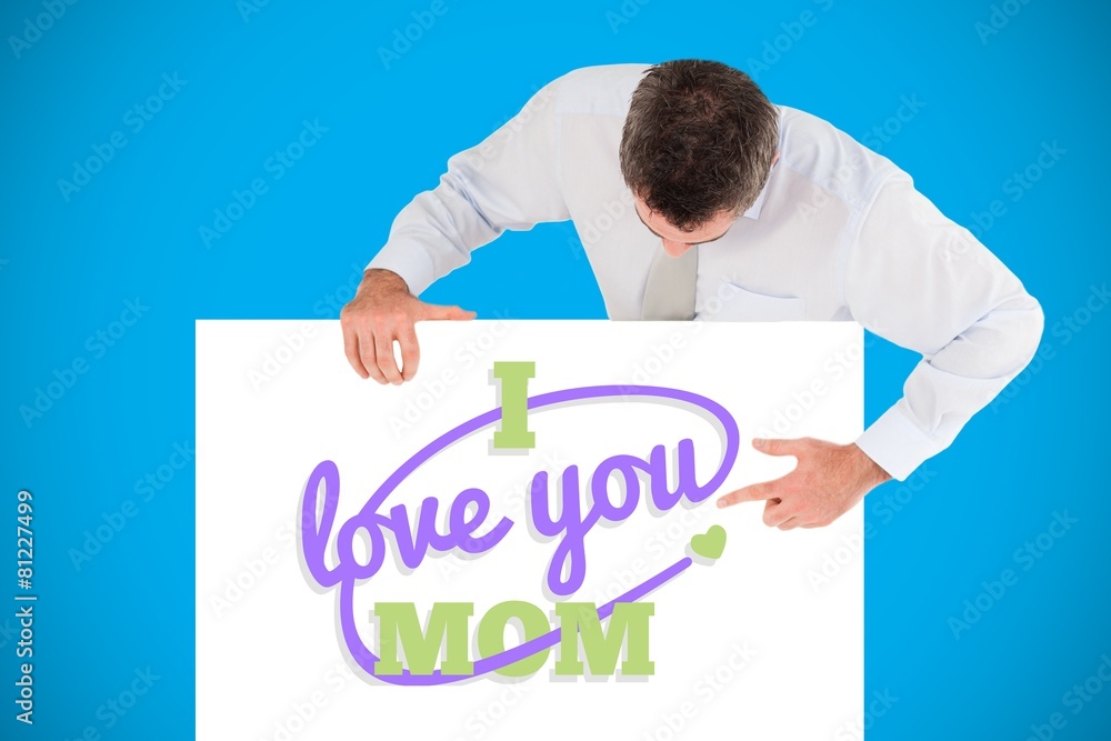 Poster businessman pointing at something on a blank