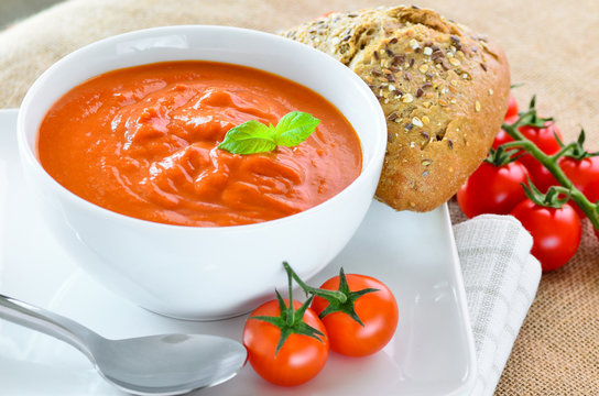 Fresh tomato soup and fresh baked crusty bread rolls.