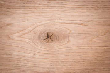 A wooden background with a knag