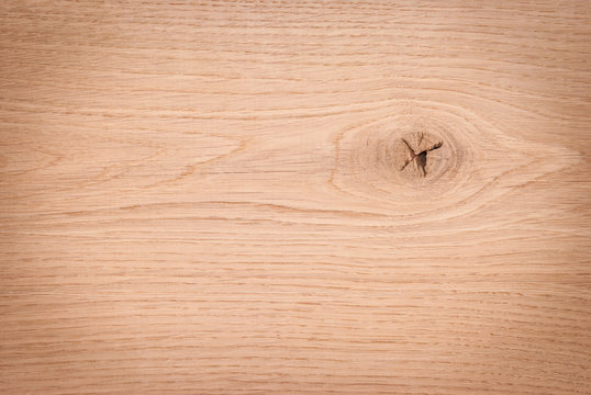 A wooden background with a knag