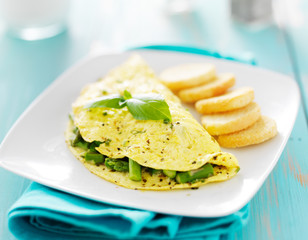 asparagus egg omelet with basil garnish