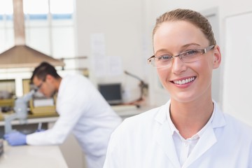 Happy scientist smiling at camera