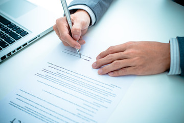 Business man signing a contract