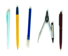 isolated pens and compasses