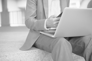 Naklejka premium Young successful young man holding a report. Accounting