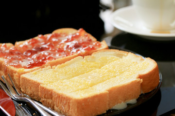 Toast with butter and sprinkling with sugar.