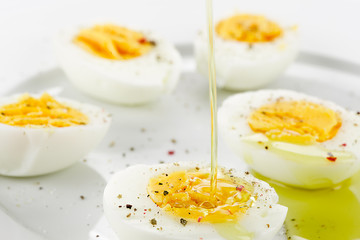 Pouring Oil on Boiled Egg