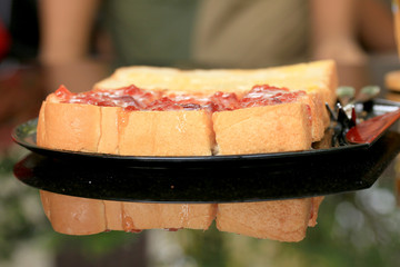 Toast with butter and sprinkling with sugar.