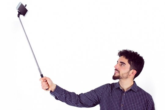 Casual Man Using A Selfie Stick