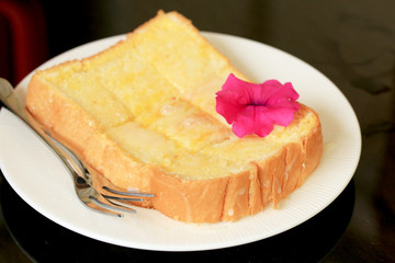 Toast with butter and sprinkling with sugar.