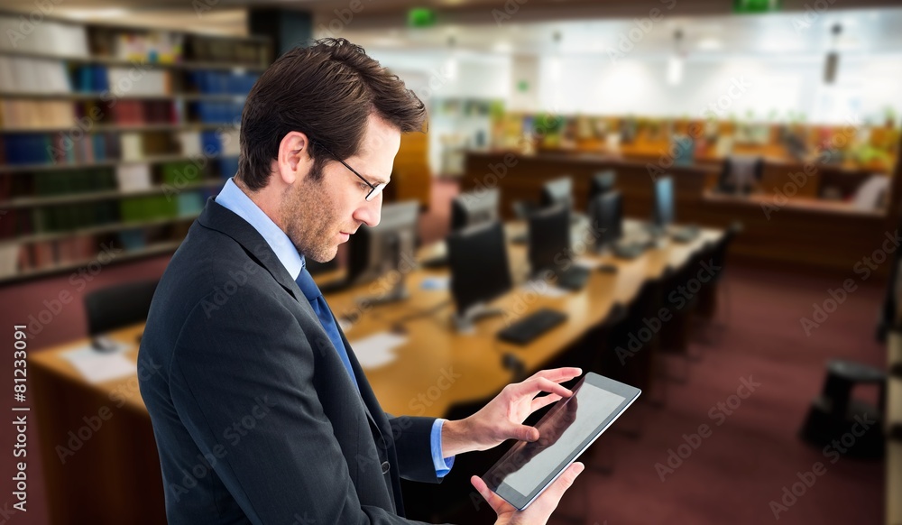 Aufkleber Composite image of businessman standing while using a tablet pc