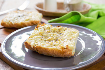 Melted Cheddar and Parmesan cheese on baguette