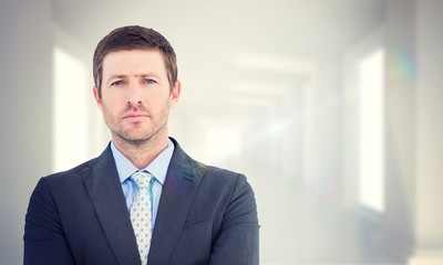 Obraz premium Composite image of businessman looking at the camera