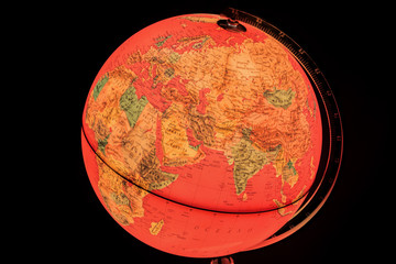 terrestrial globe on black background