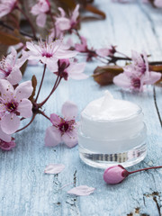 natural facial cream with fresh spring flowers